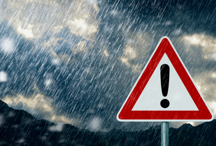 Car driving in heavy rain showing the challenges of driving in bad weather in Ireland