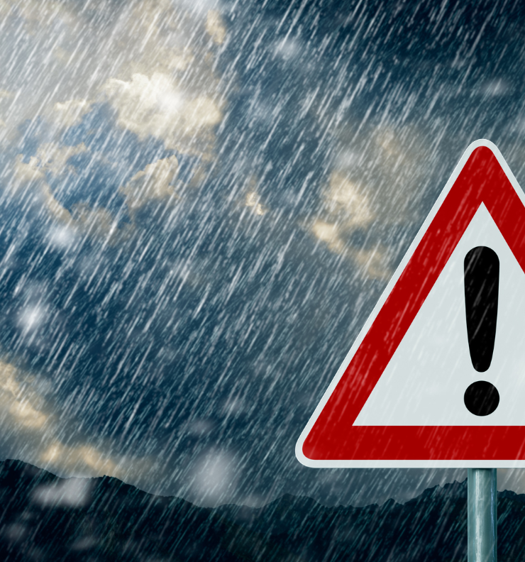 Car driving in heavy rain showing the challenges of driving in bad weather in Ireland