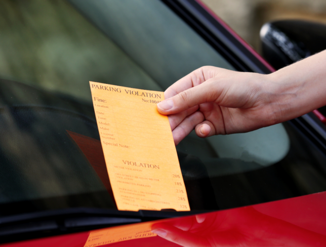 Parking charge notice on a car windscreen showing what happens if you forget to pay for parking