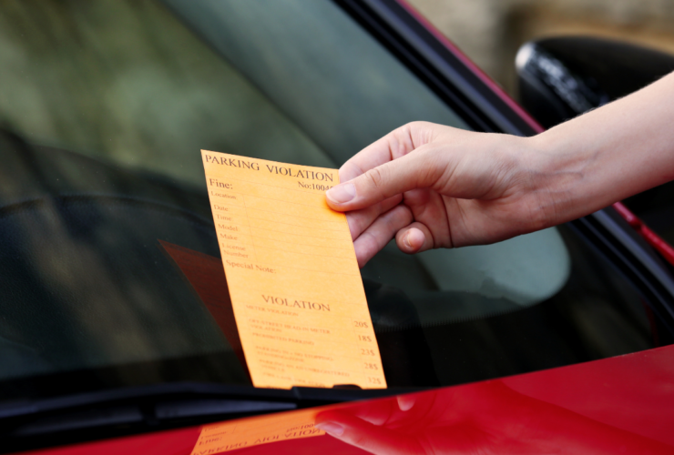 Parking charge notice on a car windscreen showing what happens if you forget to pay for parking