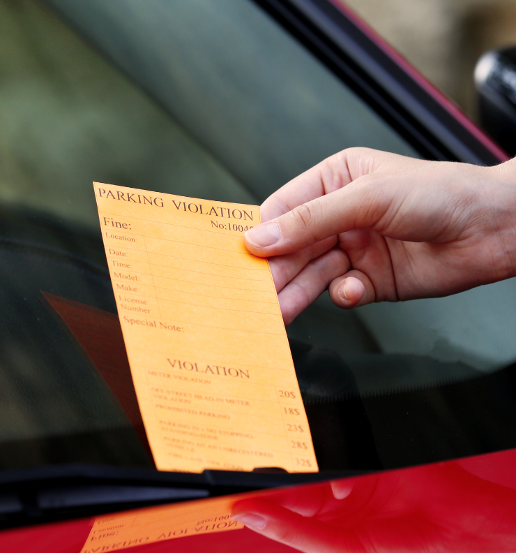 Parking charge notice on a car windscreen showing what happens if you forget to pay for parking